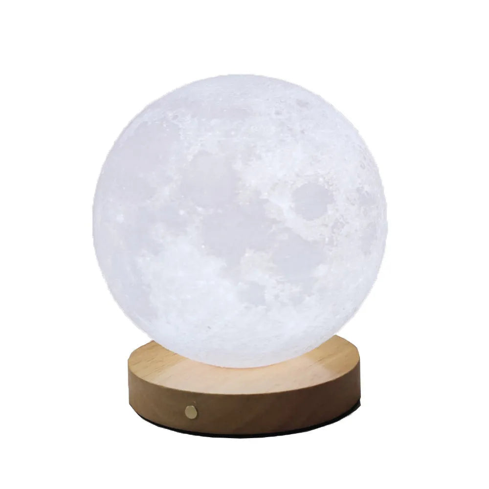 Rotating three-colour moon night light on a wooden base, showing 12cm, 15cm, and 18cm size options.