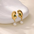 Pair of stainless steel stud earrings with green zircon and pearl geometric design