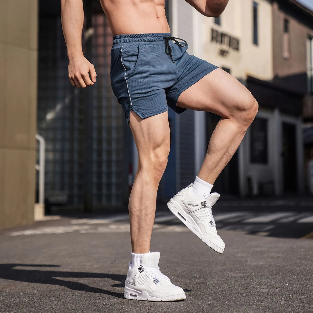 Men's straight cut polyester sports shorts in black, grey, navy, and red colours.
