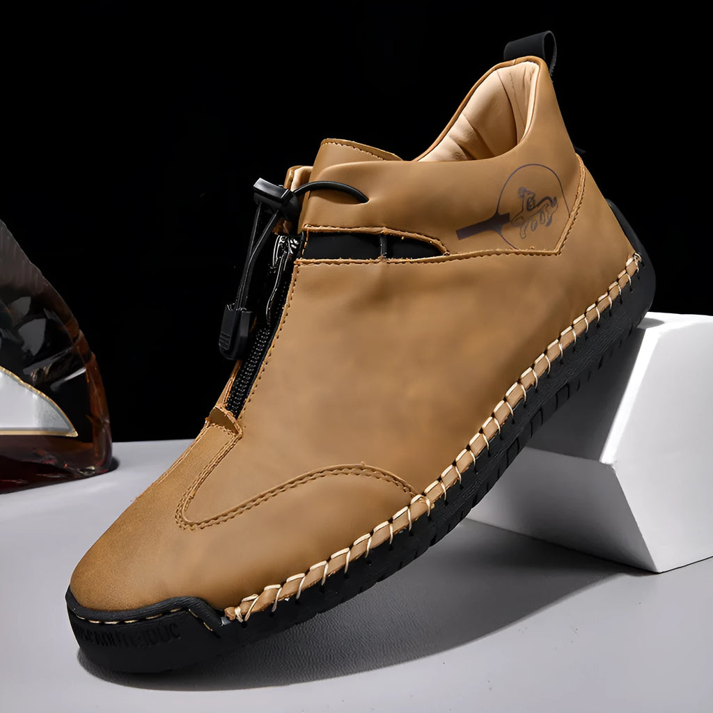 Casual men's leather travel shoes in black with rubber sole, mid heel, and round toe