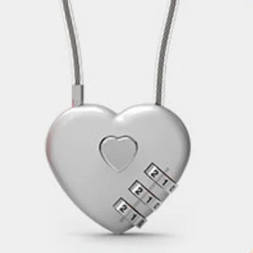 Peach Heart shaped wire rope lock in ABS plastic for securing bicycle helmets.