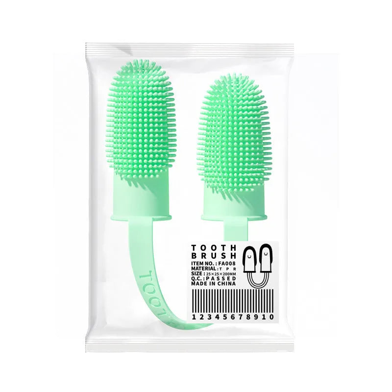 Close-up of blue green and pink silicone finger sleeves for pet dental cleaning on a hand.