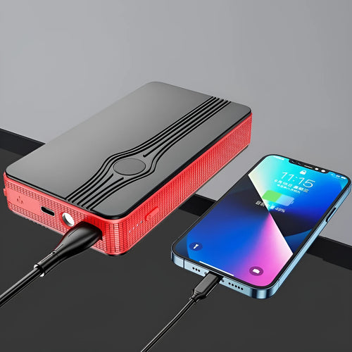 Red K4-E portable car jump starter and power bank with data cable, showing compact size for vehicle glovebox storage.