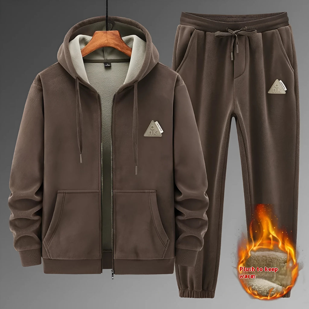 Grey cashmere hooded sportswear suit with long sleeves and matching trousers on a hanger