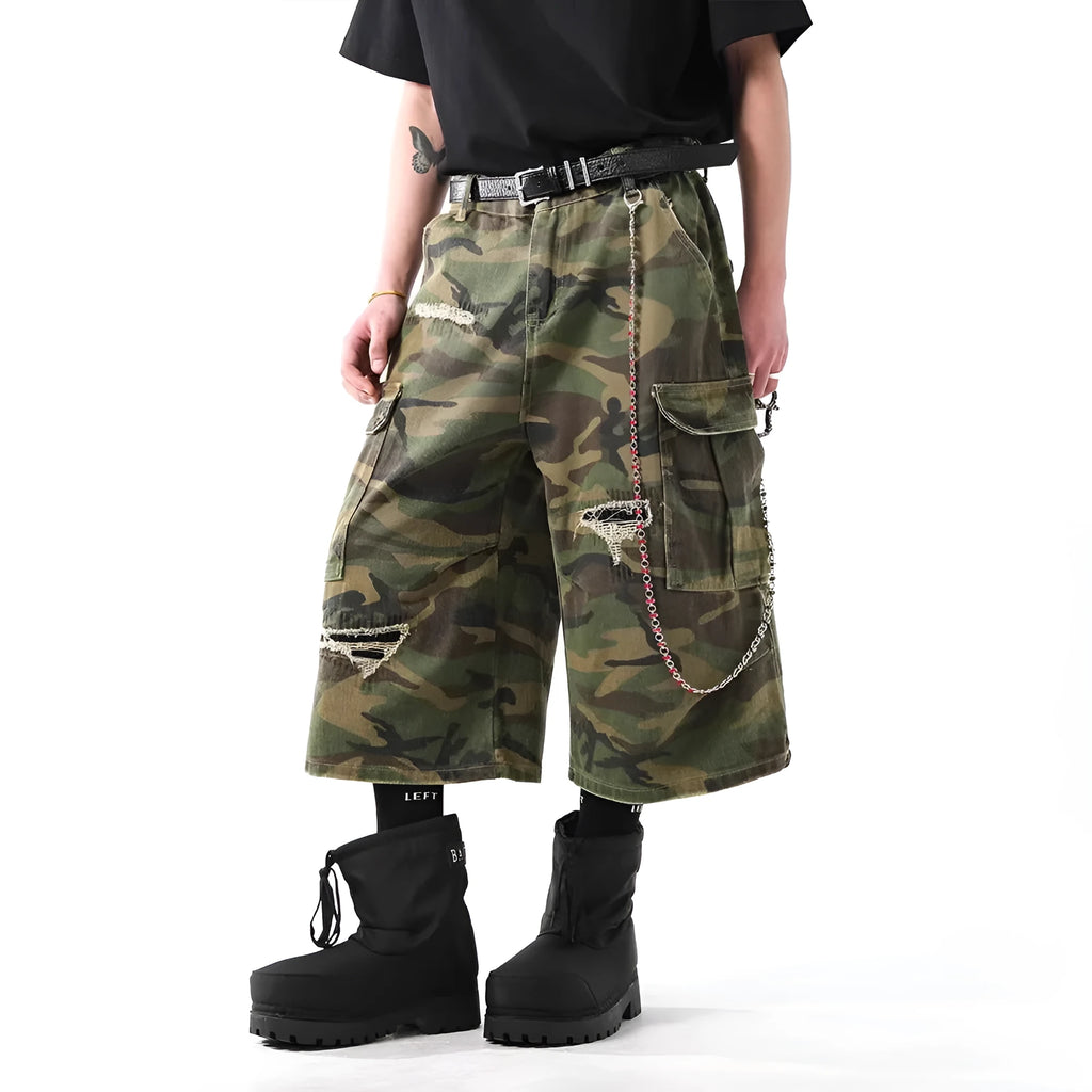 Men's straight-leg cropped trousers in a green and brown camouflage pattern, made from cotton denim.