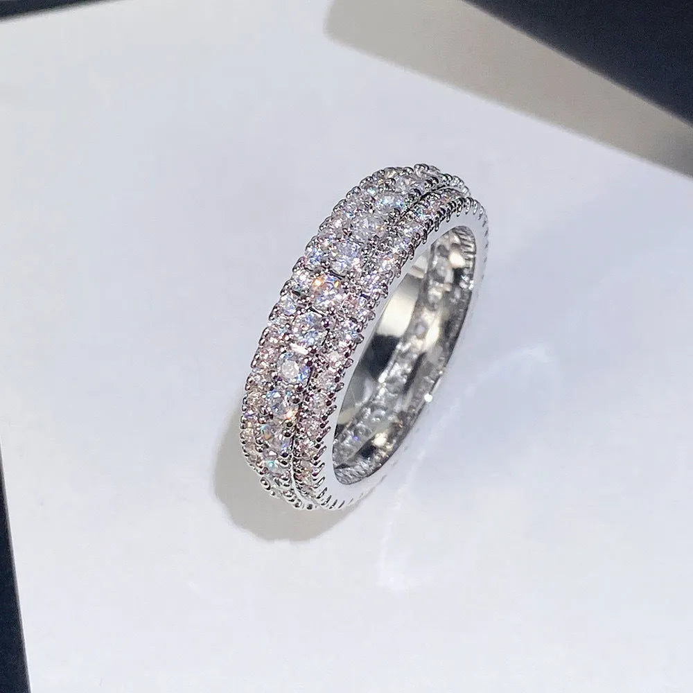 Personalised geometric triangle engagement ring with zircon inlay on a copper band.