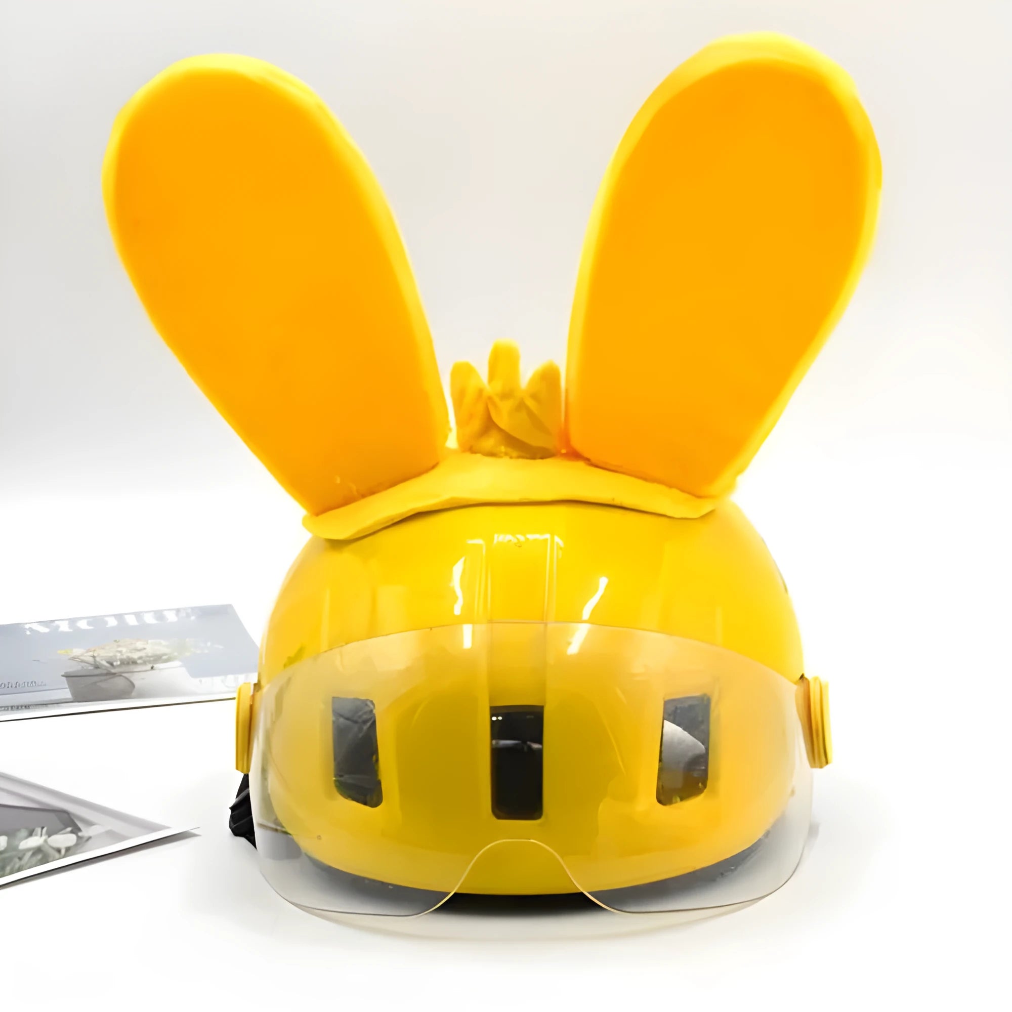 Rabbit Glow helmet decoration with Velcro bottom on a ski helmet, shown in blue LED style.