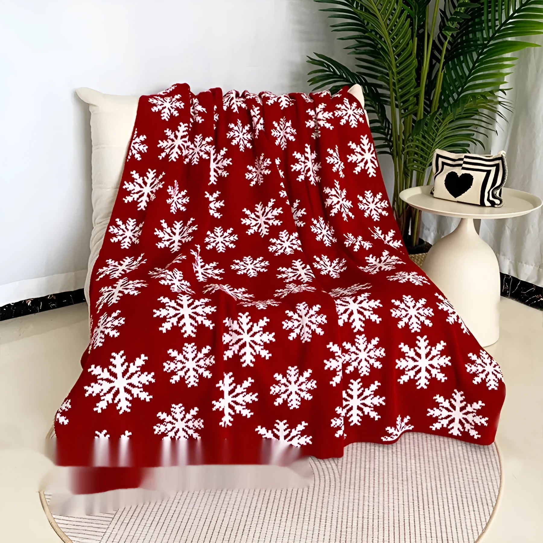 Christmas acrylic blanket with snowflake pattern in 110x130cm size on sofa