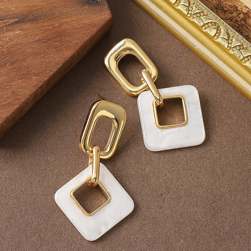 Hollow geometric square earrings with chamfered pattern in electroplated copper