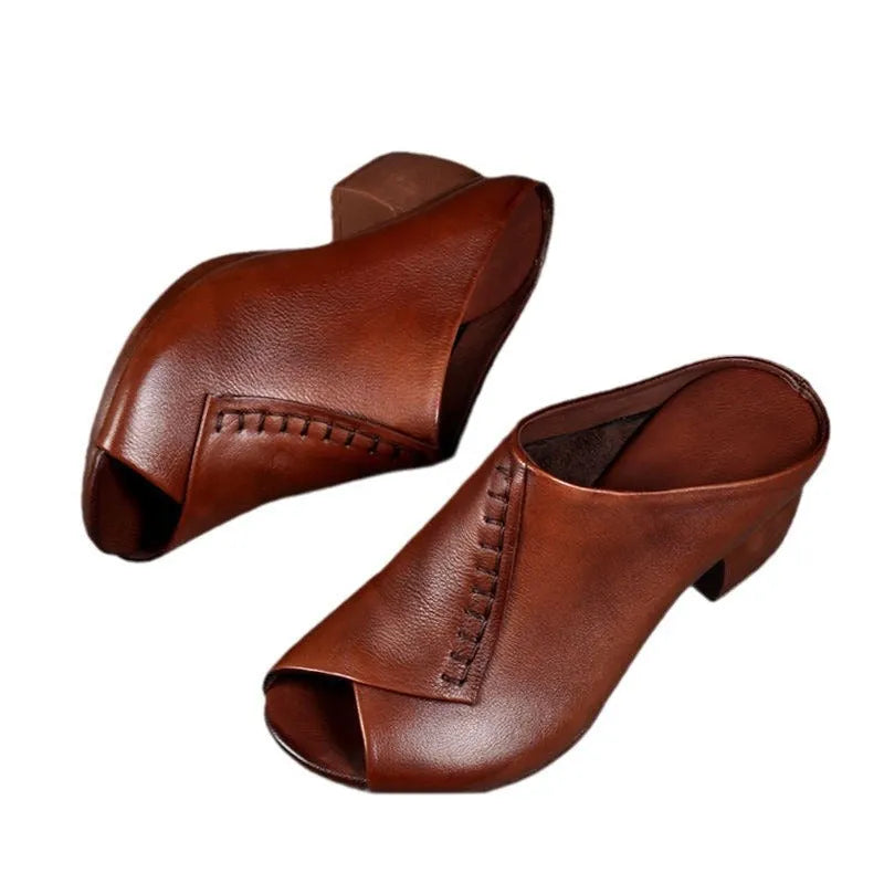 Women's black square heel peep-toe slippers showing fish mouth scaffold design and rubber sole