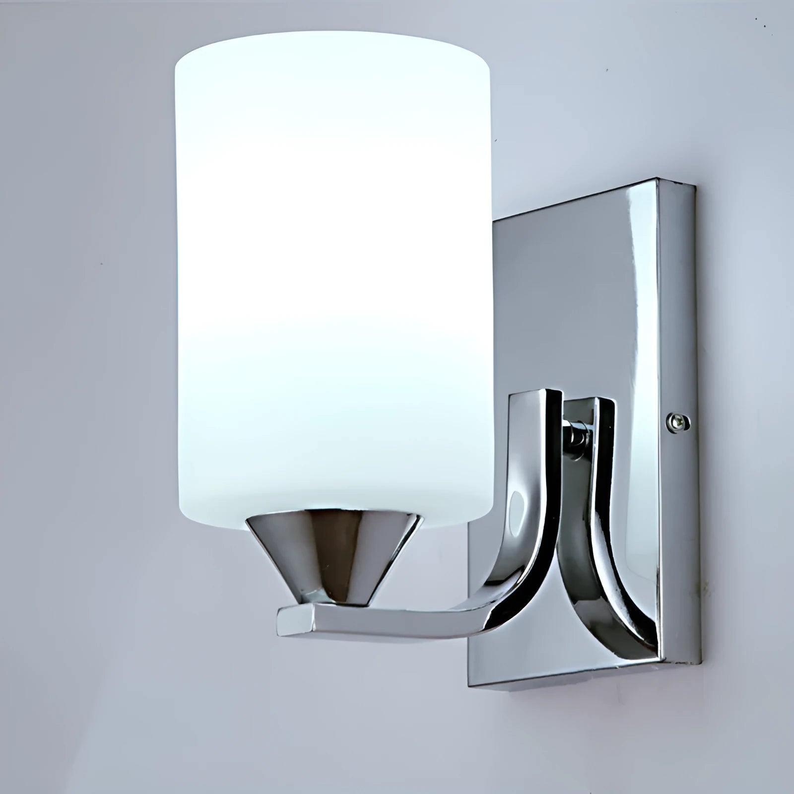 Chrome-finished modern wall lamp with glass shade, shown in single head configuration.