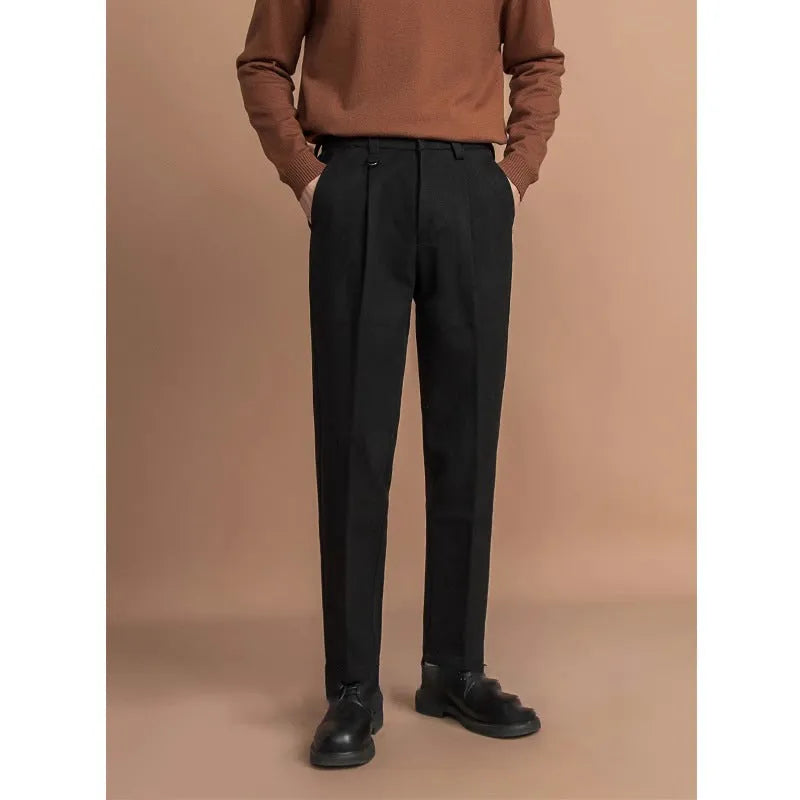 Men's straight-leg casual trousers in draped design, shown in a neutral colour on a hanger.