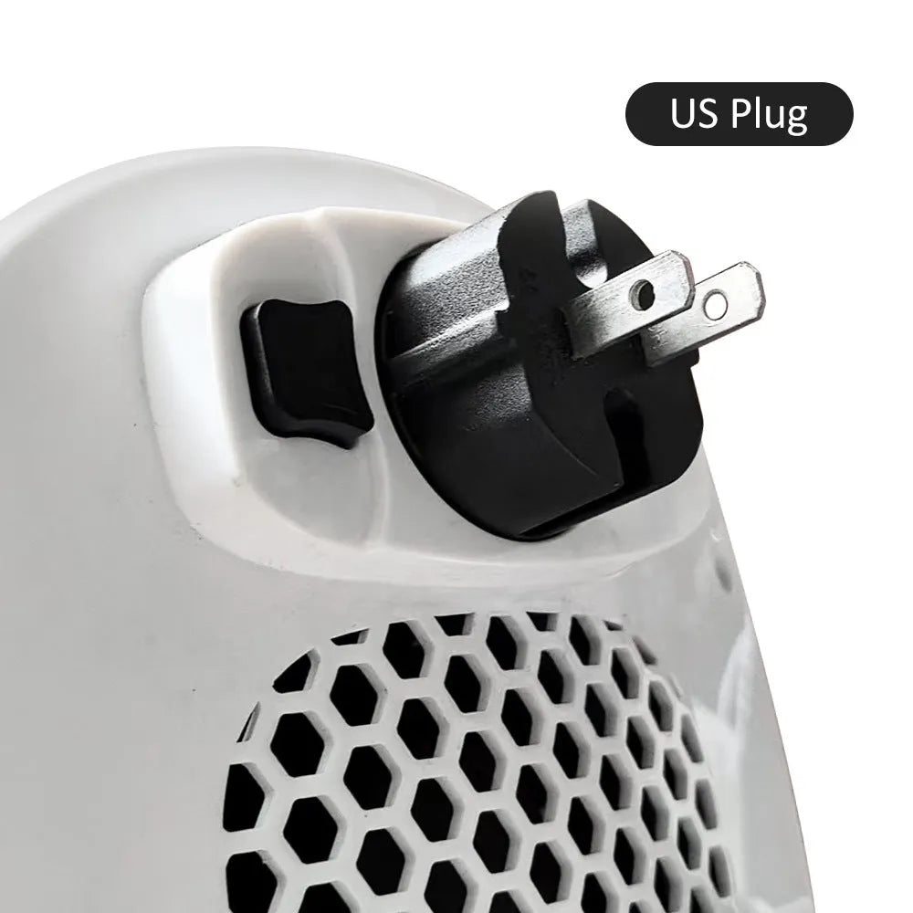 White portable ceramic electric heater with remote control on table