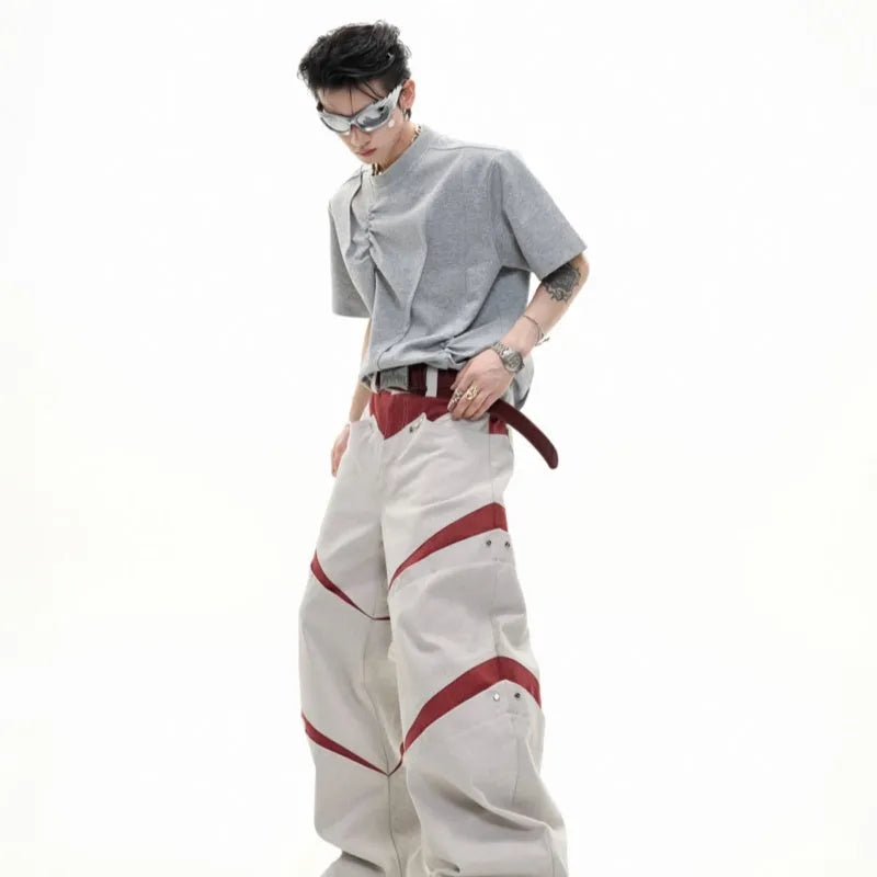 Men's loose grey cotton T-shirt with round neck and asymmetric stitching on the front.