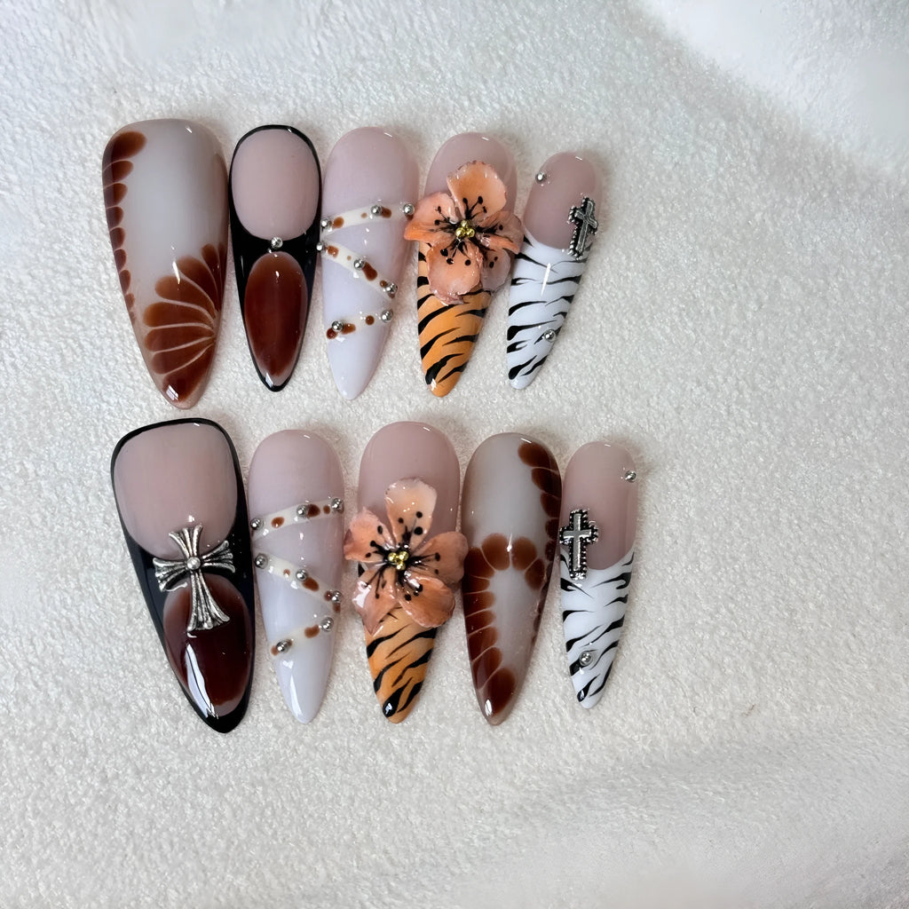 Leopard print false nails with cross and flower patterns in French style, shown in sizes XS S M L.