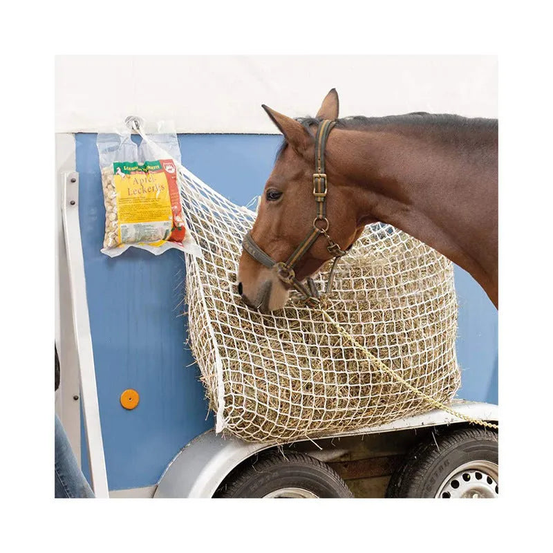 Woven polyethylene rope hanging feeding bag for livestock in a grid design.