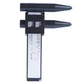 Electronic digital hole distance ruler on a workshop bench.