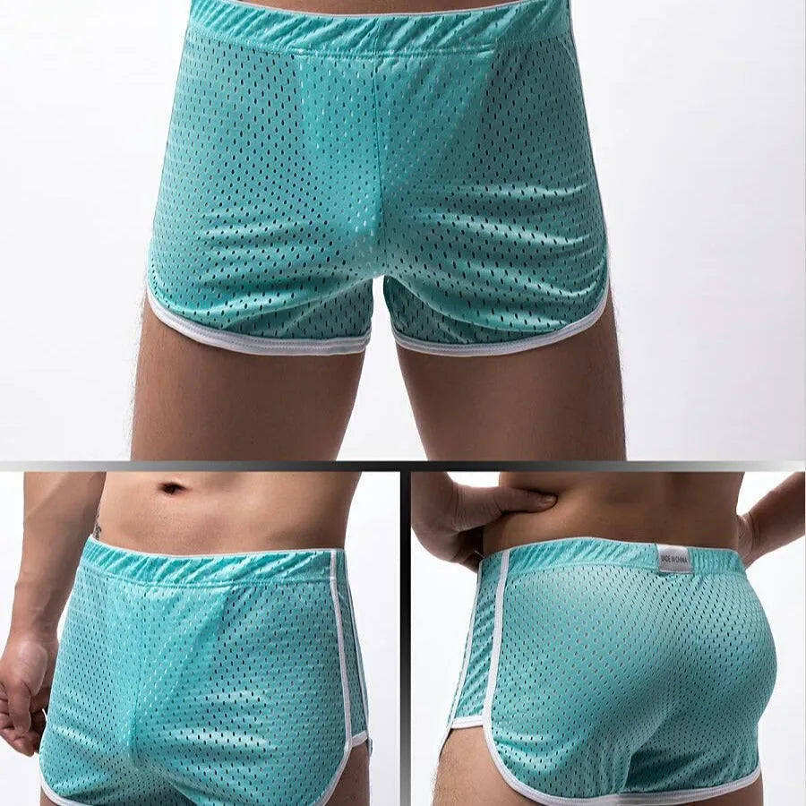 Men's black three-point boxer shorts made from a knitted cotton and nylon blend on a plain background.