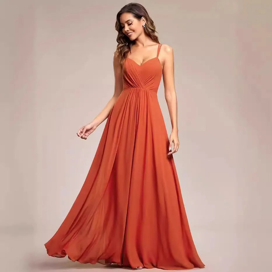 Women's sleeveless banquet dress with pleated A-line long skirt in light green, showing sling neckline.