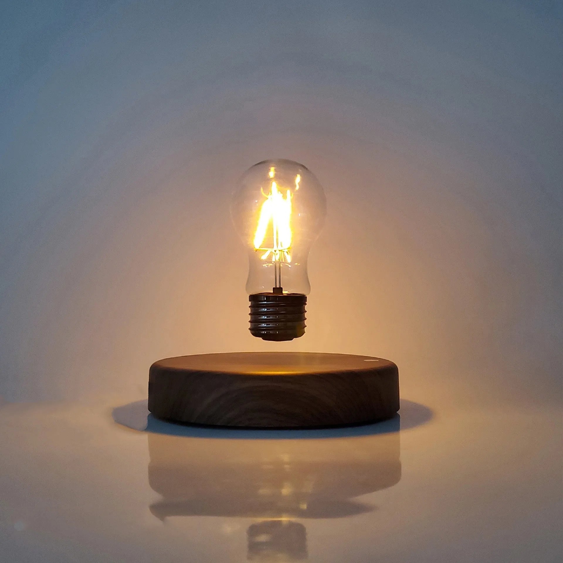 Magnetic levitation bulb night light in solid wood colour with floating bulb and plastic lamp holder