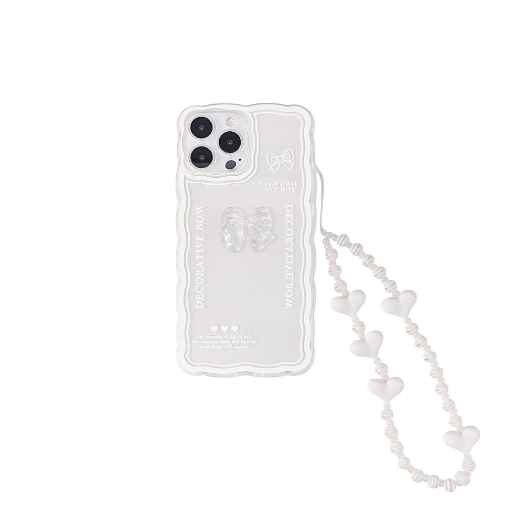 Clear transparent iPhone case with a raised ice-blue bow decoration on the back