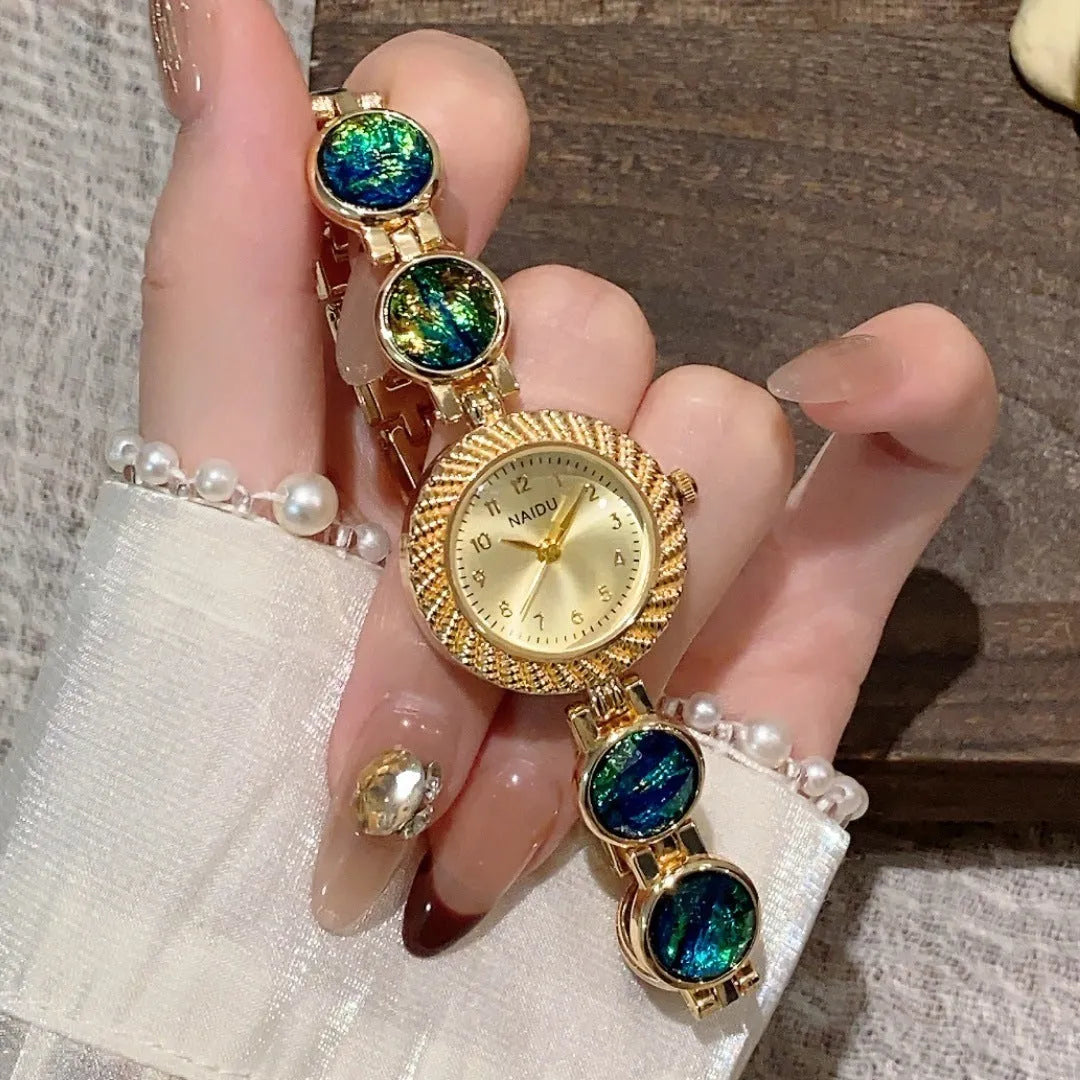 Women's quartz watch with round 25mm dial in milky white colour, zinc alloy case, and spiral crown.