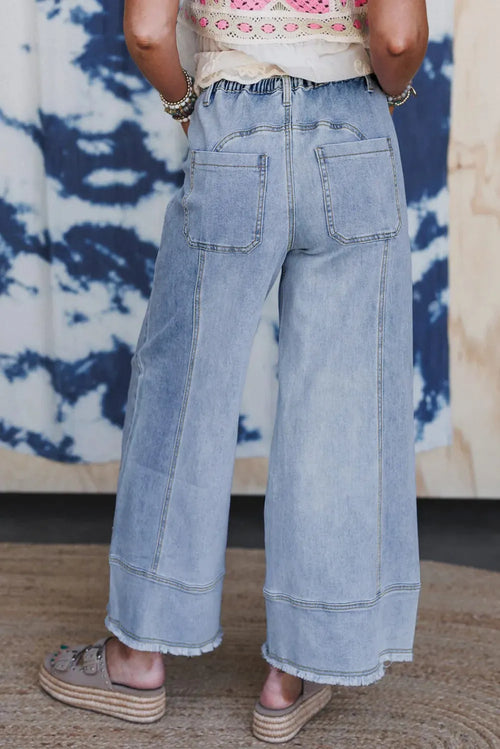 Beau Blue wide leg denim trousers with drawstring waist and raw unfinished hem detail