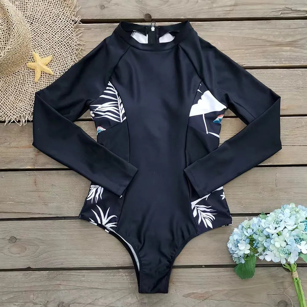 Black women's long-sleeved one-piece diving suit with printed pattern.