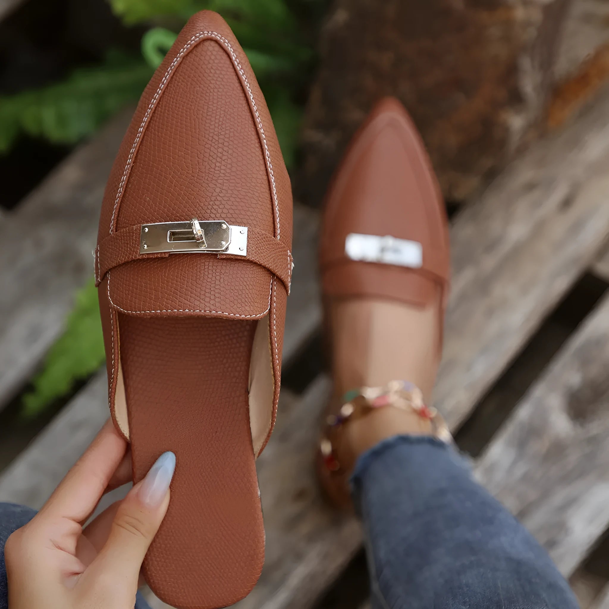 Light brown women's pointed toe slippers with a low heel, showing PU upper and rubber sole.
