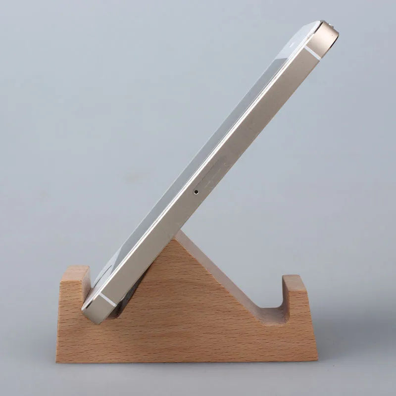 Beech wood and resin lazy bracket mobile phone holder in an animal design style on a desk.