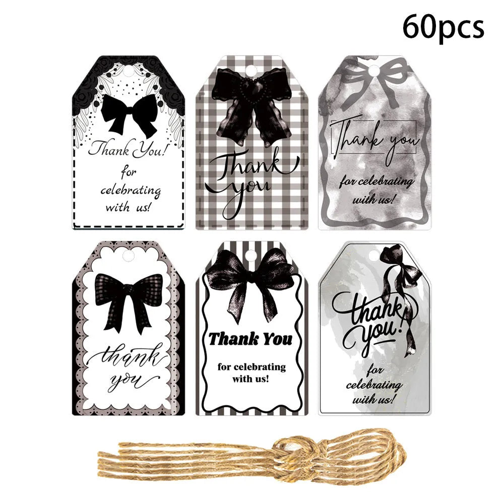 Three style variations of creative bowknot gift label tags with hemp rope attachments