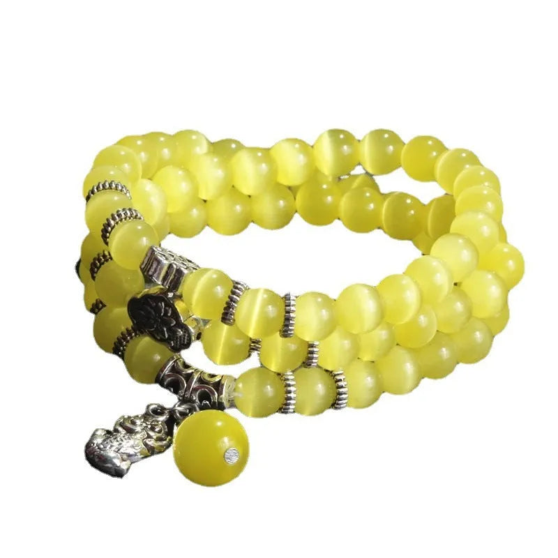 Opal crystal cat eye bracelet with lucky cat charm, shown in one of six colour options.