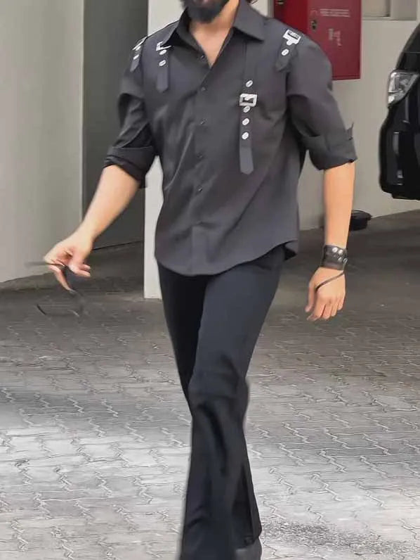 Man wearing a regular fit black polyester button-up utility shirt.