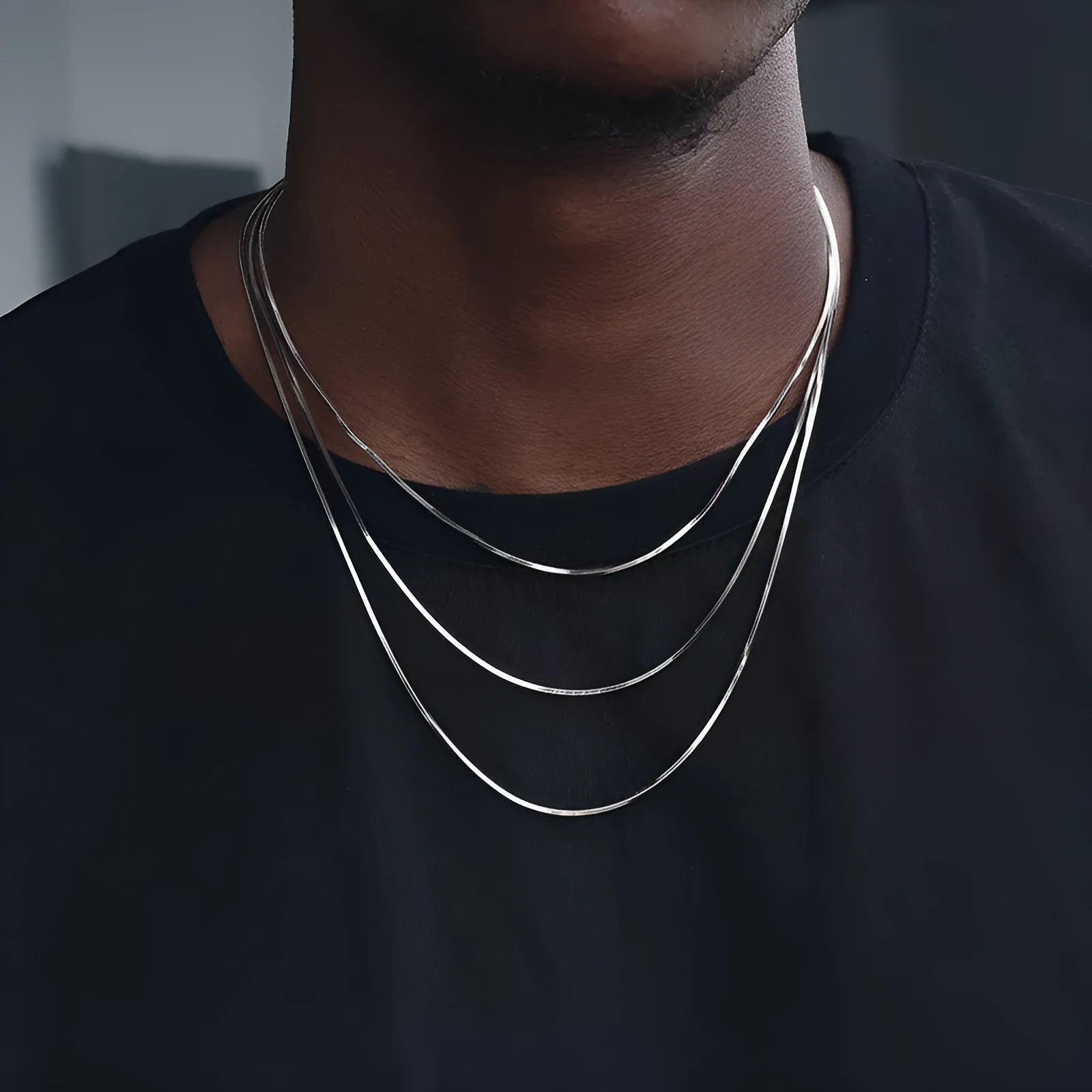 S925 sterling silver plated platinum snake bone chain necklace on display, silver colour, unisex design, 45-60cm length options