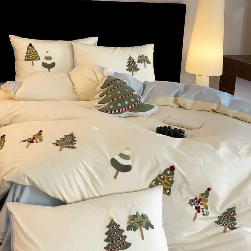 Pure cotton four-piece bed set with embroidered Christmas tree pattern in cream blue and green colours.