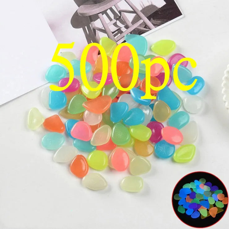 Luminous fluorescent aquarium and garden pebbles in mixed colours including dark purple, yellow, light blue, pink, orange