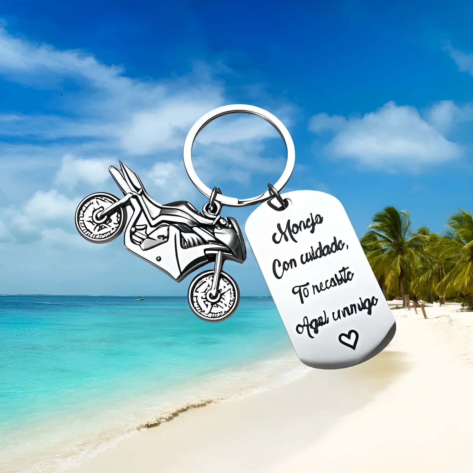 Stainless steel motorcycle-themed keychain on a velvet flannel bag