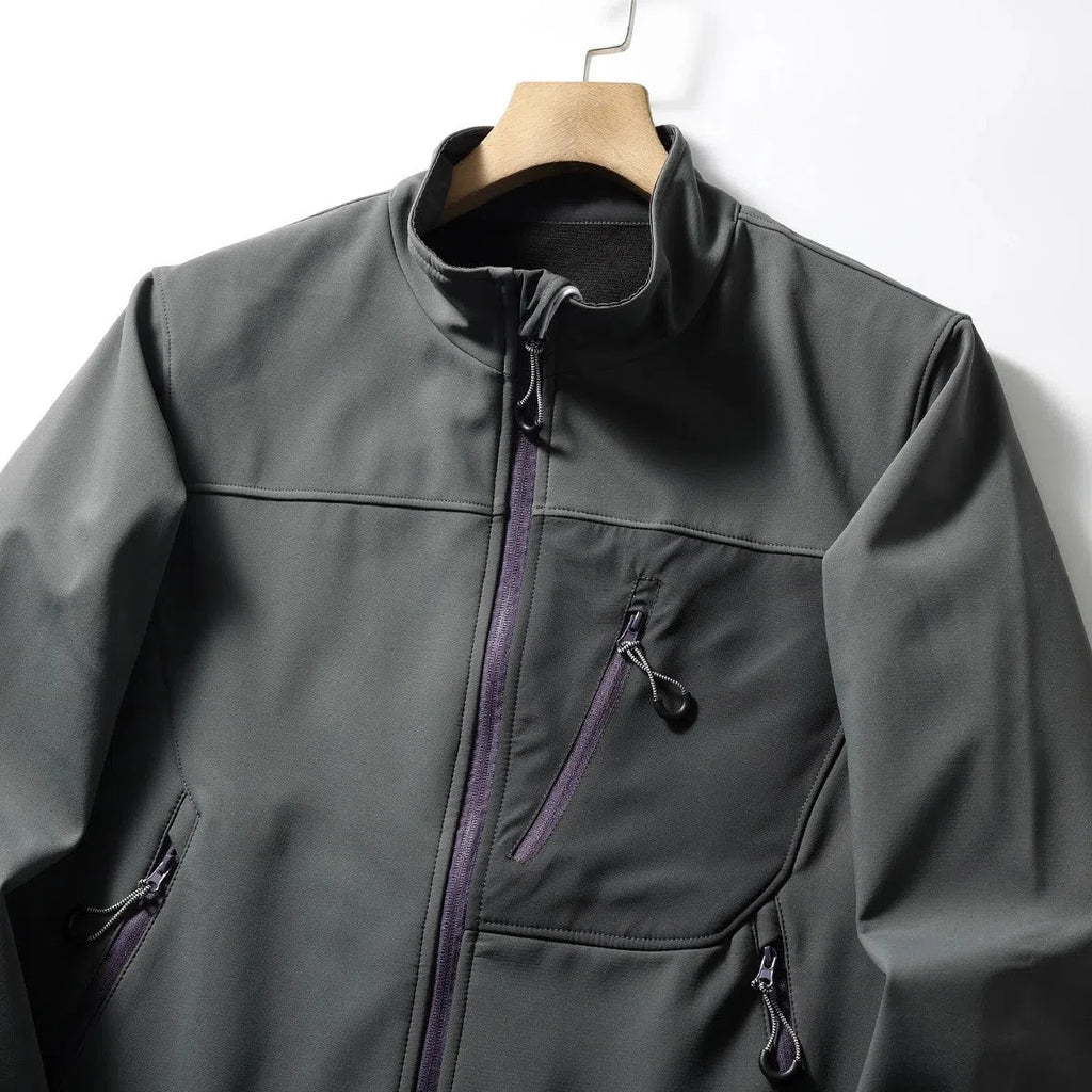 Men's retro patchwork contrast colour stand-up collar coat in Misty White, side view showing zipped pockets