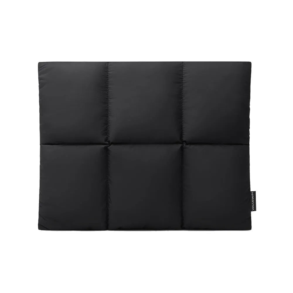 Soft black fluffy laptop sleeve for a 15.6 inch laptop, showing sewn retro style details.