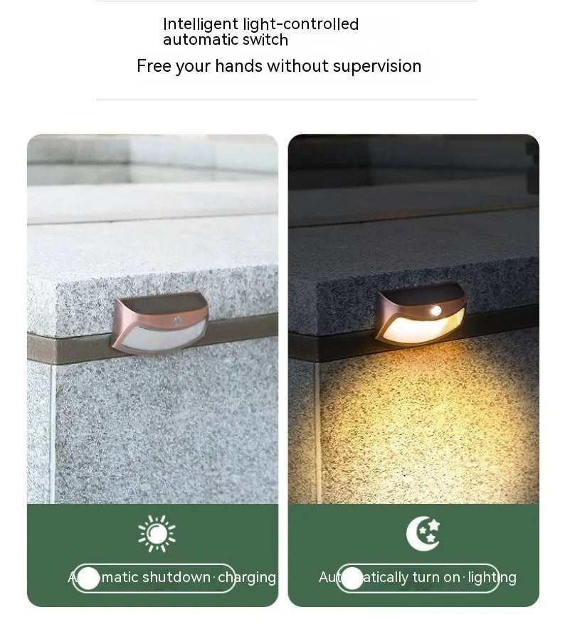 Solar-powered outdoor wall lamp with smiling face design for garden or courtyard lighting.