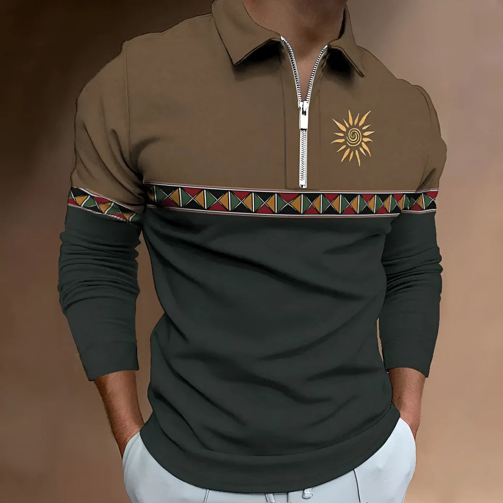 Man wearing a loose-fit long sleeve golf top with retro colour printing and a zipper decoration detail.