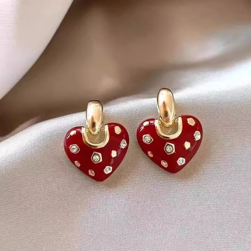 Pair of red heart-shaped ear studs in zinc alloy with electroplated finish