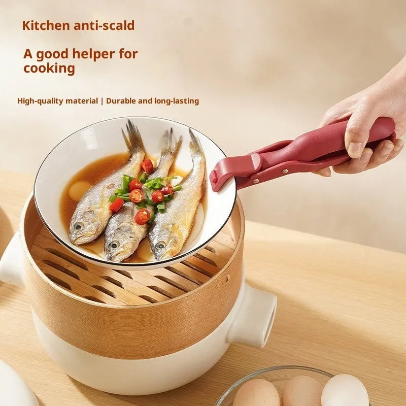 Carmine coloured anti-scalding clip with PP handle and silicone grip on kitchen counter