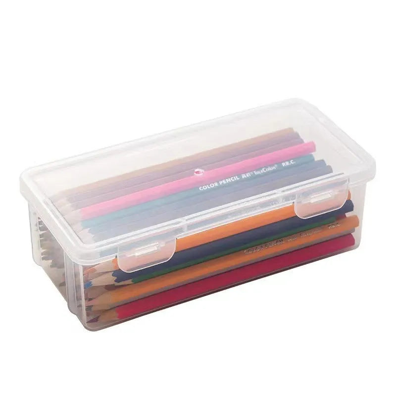 Large clear plastic stationery storage box filled with coloured pencils and crayons