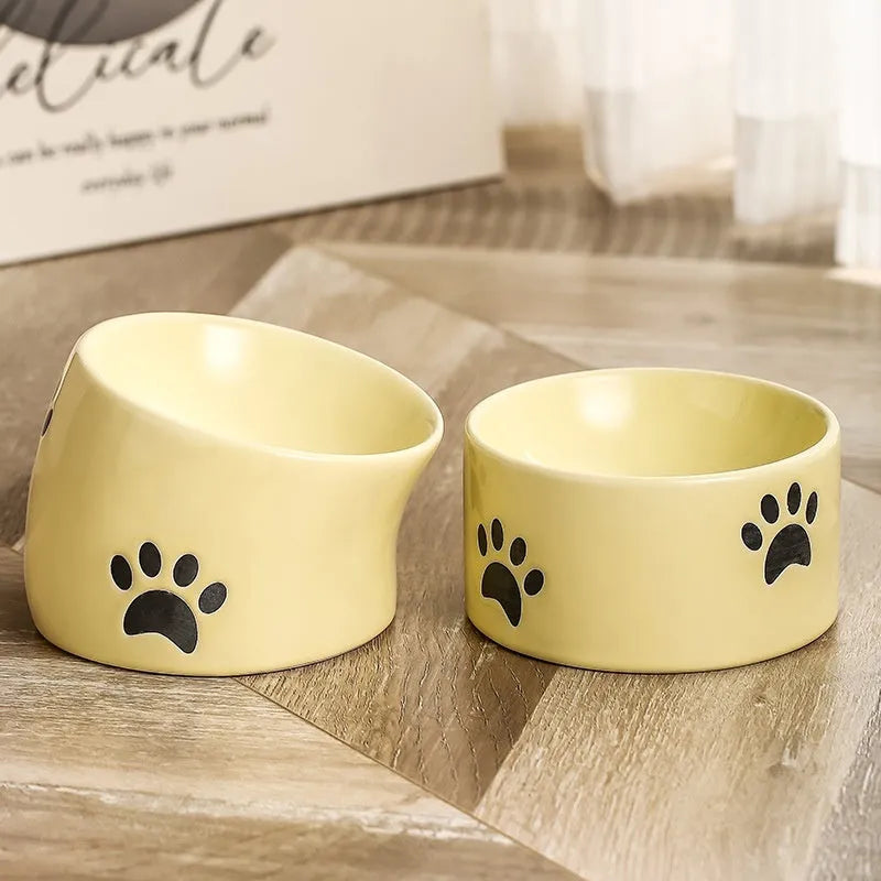 Ceramic cat bowl with high foot design in cat's paw pattern available in multiple colours