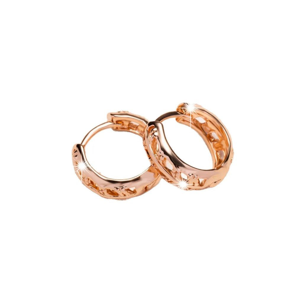 Rose gold copper leaf hollowed out earrings with a heart shape design.