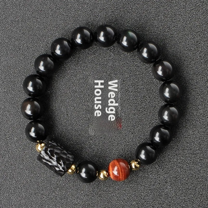 Obsidian bracelet with 10mm yellow tiger eye beads showing manual processing details and retro circle style
