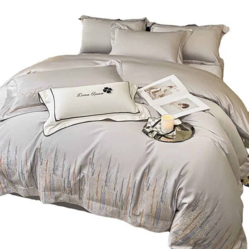 Pure cotton four-piece bedding set with embroidered details, available in dove gray, ruifen, or xingyao blue, for 1.5m or 1.8m bed