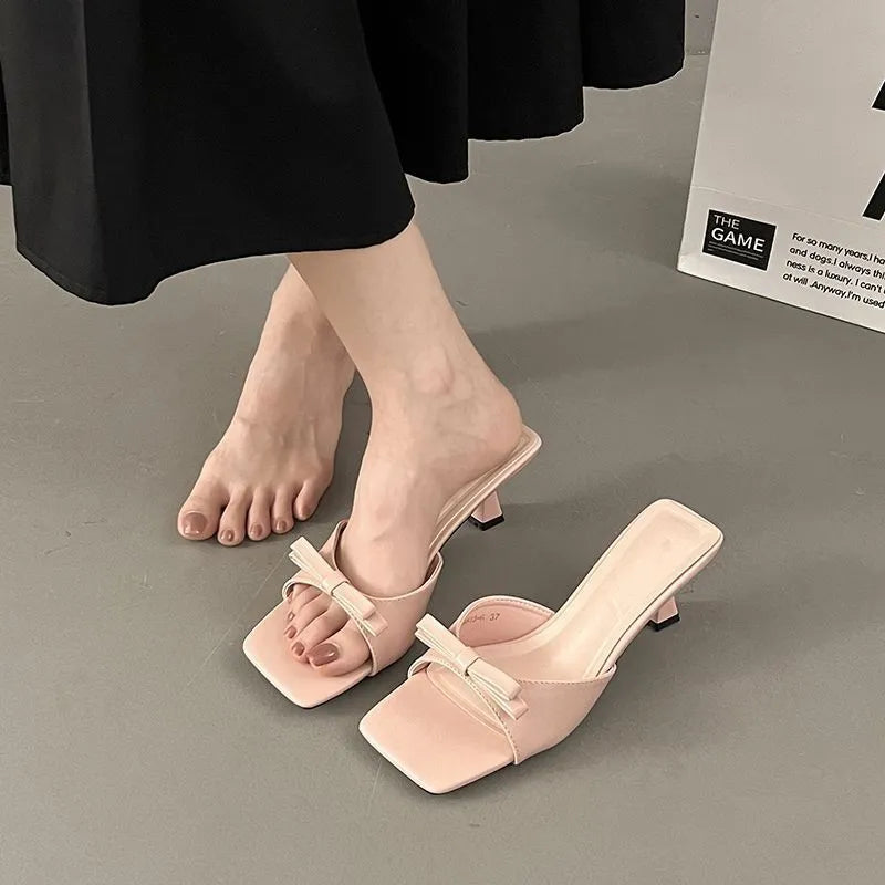 Korean style bow slippers with skirt design, PU upper and rubber sole, black upgraded version