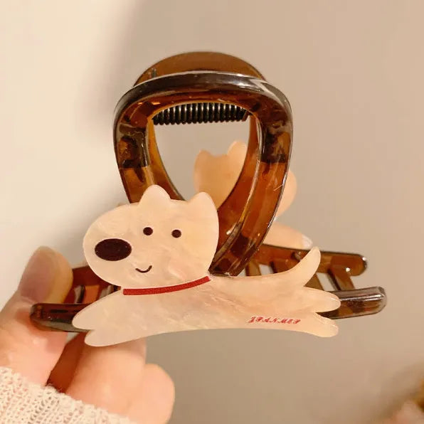 Cute cartoon puppy shaped hair barrettes with a grip clip, shown in beige and brown colours.